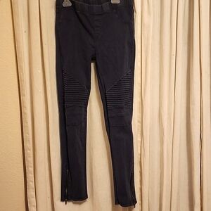 Girls moto-style black jeggings with zipper ankles, size large.